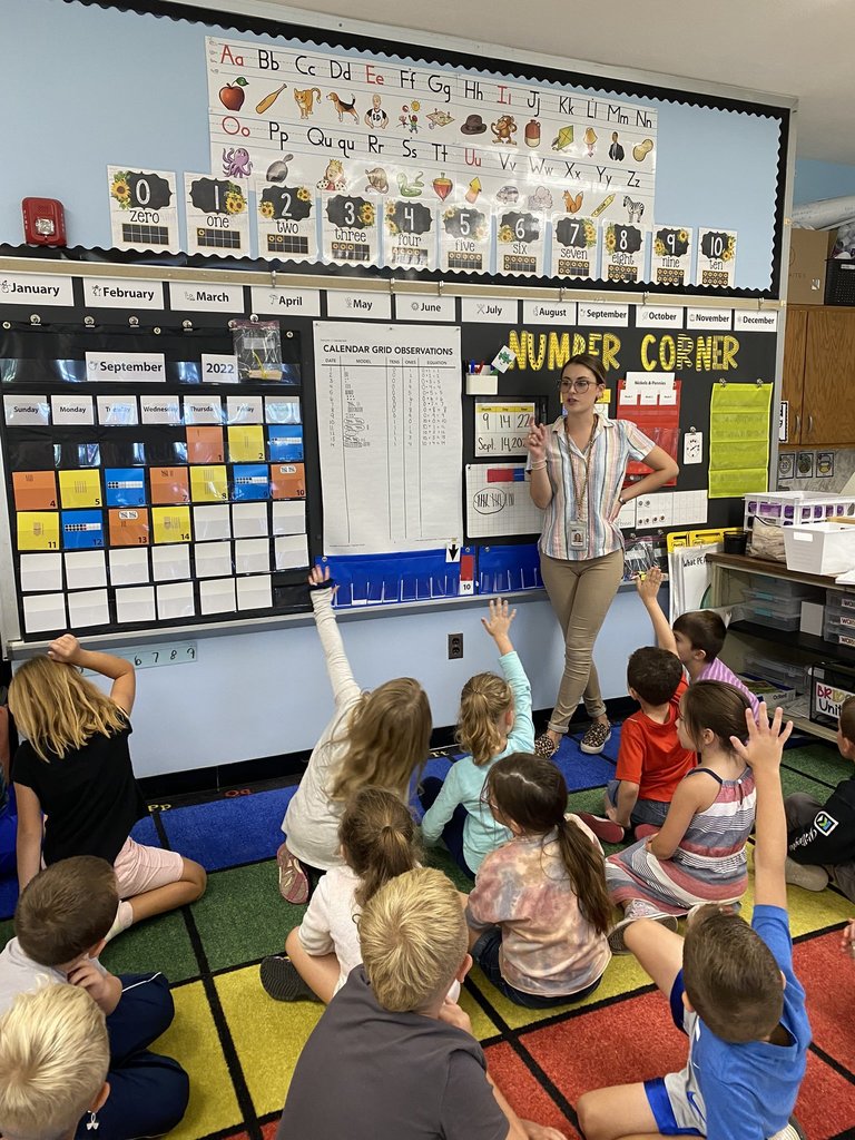 Classroom teacher teaching students about numbers